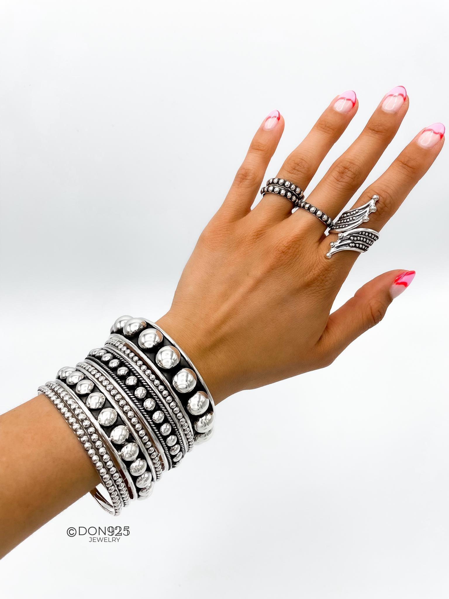 Sterling Silver Southwestern Studded Bangle: Inclusive Sizes